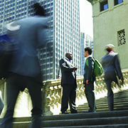 Two businessmen meeting on steps